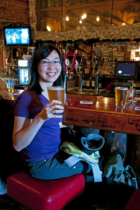 Charlotte drinking a seasonal Summer Alaska Ale