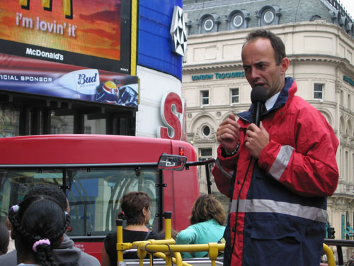 Our_tour_guide_on_the_double_decker_bus.jpg