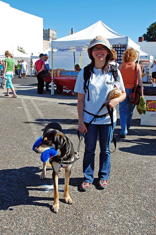 Mulder picks out a toy at the Astoria Farmers Market.jpg