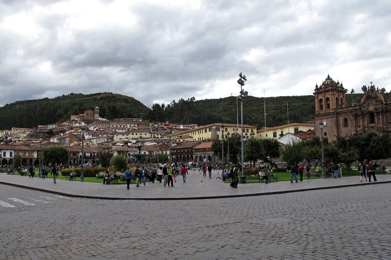 Plaza De Armas looking up at Sacsayhuaman.jpg