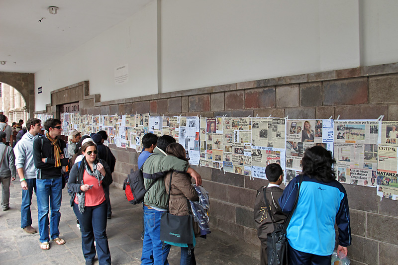 Wall of weird local political news on the main plaza.jpg