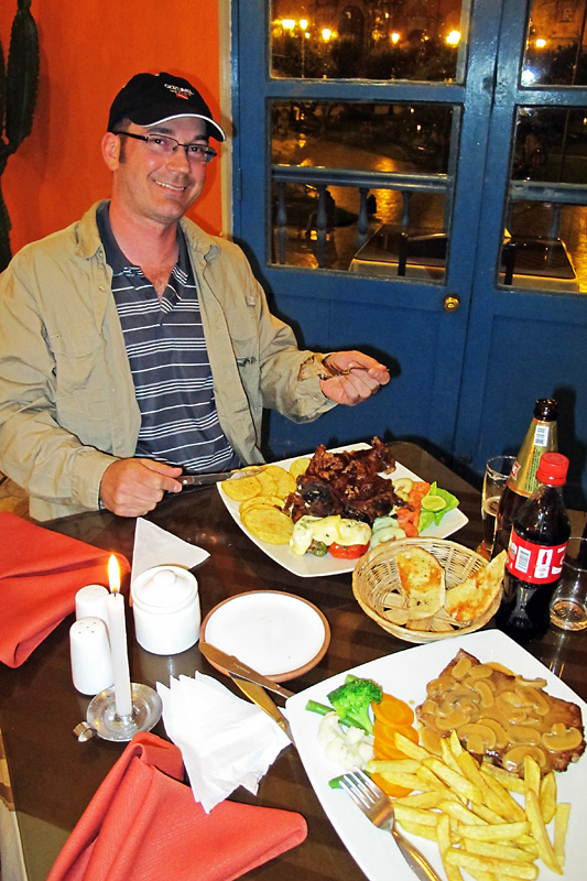 Here I am taking a bite of the Peruvian delicacy, Roasted guinea pig.jpg