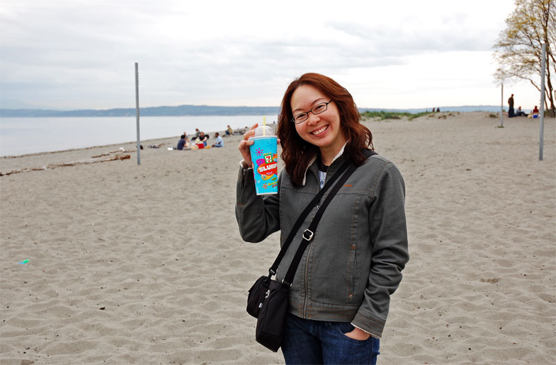 Charlotte-enjoying-a-drink-on-the-beach.jpg