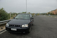 A_picture_of_Charlotte_in_our_rental_car_somewhere_around_Corinth.jpg