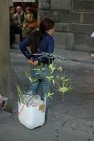 Street_vendor_selling_palm_tree_decorations.jpg