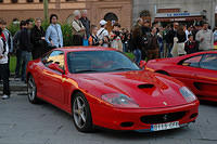 The_locals_and_tourists_ooh_and_aww_over_the_nice_cars.jpg